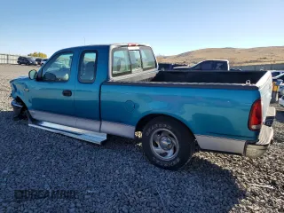 1997 Ford F-150 with VIN 1FTDX1725VKC16240, listed as a Copart auction lot 80091964 with 115,205 mi miles and Salvage title. Bid and sale history available at DreamBid. Image 2.
