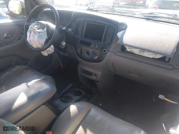 2002 Mazda Tribute LX with VIN 4F2YU08142KM18539, listed as a IAAI auction lot 41742104 with 230,254 mi miles. Bid and sale history available at carsss.com. Image 5.