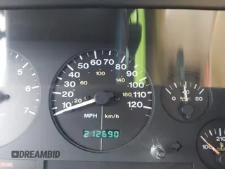1996 Jeep Grand Cherokee Limited z VIN 1J4GZ78Y3TC191000, wystawiony jako IAAI lot #42259621 z przebiegiem 212 690 mil mil oraz . Historia ofert i sprzedaży dostępna na DreamBid. Obrazek 7.