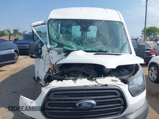 2016 Ford Transit Cargo z VIN 1FTYR2CM6GKA55411, wystawiony jako IAAI lot #42582896 z przebiegiem 89 921 mil mil oraz . Historia ofert i sprzedaży dostępna na DreamBid. Obrazek 12.