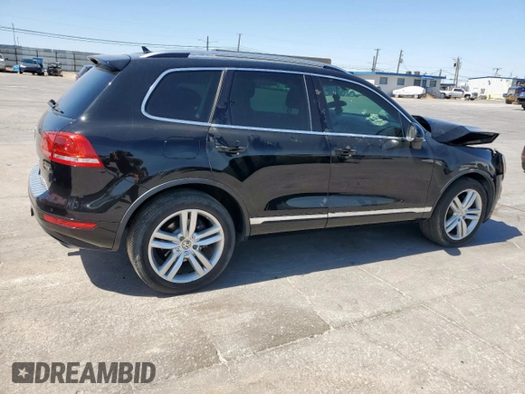 2013 Volkswagen Touareg Exec z VIN WVGEF9BPXDD007602, wystawiony jako Copart lot #50031785 z przebiegiem 93 859 mil mil oraz Szkody całkowita. Historia ofert i sprzedaży dostępna na DreamBid. Obrazek 3.