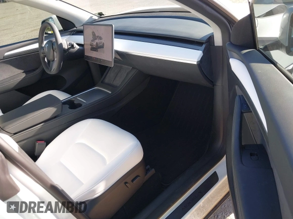 2023 Tesla Model Y Performance with VIN 7SAYGDEF2PF754938, listed as a IAAI auction lot 42067041 with 21,103 mi miles and . Bid and sale history available at DreamBid. Image 5.