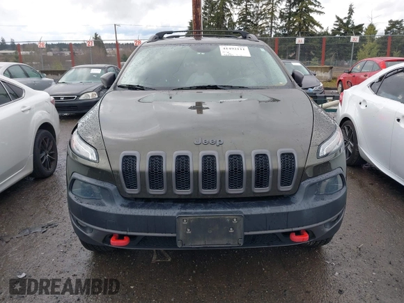 2015 Jeep Cherokee Trailhawk with VIN 1C4PJMBB5FW510514, listed as a IAAI auction lot 41492111 with 98,482 mi miles and . Bid and sale history available at DreamBid. Image 13.
