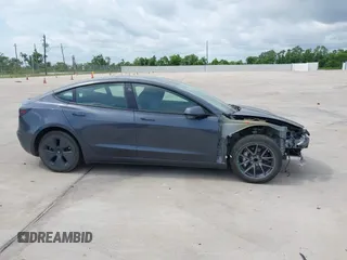 2023 Tesla Model 3 with VIN 5YJ3E1EA7PF417293, listed as a IAAI auction lot 42407659 with 22,578 mi miles and . Bid and sale history available at DreamBid. Image 13.