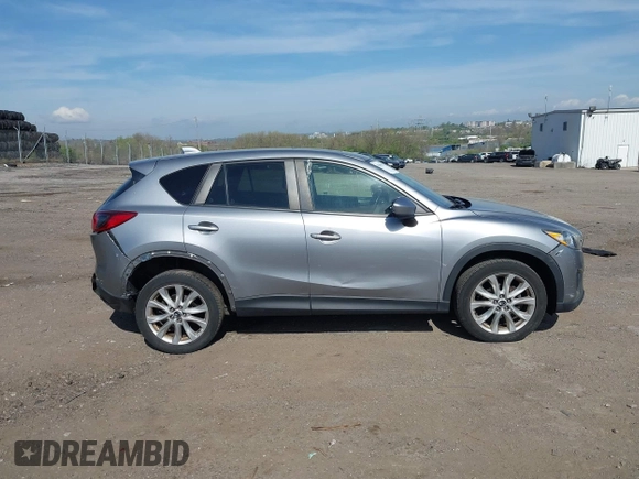 2014 Mazda CX-5 Grand Touring with VIN JM3KE4DY7E0311893, listed as a IAAI auction lot 42090872 with 102,154 mi miles and . Bid and sale history available at DreamBid. Image 13.