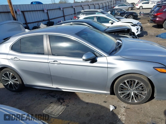 2019 Toyota Camry LE z VIN 4T1B11HK8KU681713, wystawiony jako IAAI lot #41823019 z przebiegiem 99 000 mil mil oraz . Historia ofert i sprzedaży dostępna na DreamBid. Obrazek 13.