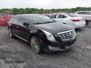2014 Cadillac XTS Luxury z VIN 2G61N5S38E9292684, wystawiony jako IAAI lot #41842596 z przebiegiem 130 318 mil mil oraz . Historia ofert i sprzedaży dostępna na DreamBid. Obrazek 1.