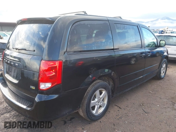 2012 Dodge Grand Caravan SXT with VIN 2C4RDGCG3CR318900, listed as a IAAI auction lot 41145958 with 201,117 mi miles and . Bid and sale history available at DreamBid. Image 4.