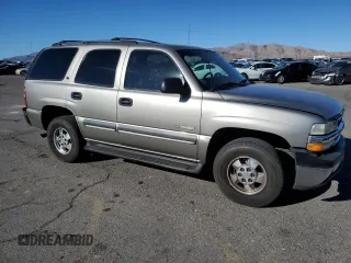 2002 Chevrolet Tahoe LS with VIN 1GNEC13V82R153063, listed as a Copart auction lot 84180594 with 148,190 mi miles and Salvage Title. Bid and sale history available at carsss.com. Image 4.