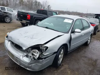 2003 Ford Taurus SE Standard with VIN 1FAFP53273G132268, listed as a IAAI auction lot 41790335 with 202,724 mi miles. Bid and sale history available at carsss.com. Image 2.