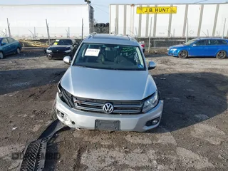 2013 Volkswagen Tiguan S with VIN WVGAV3AX0DW572915, listed as a IAAI auction lot 41937763 with 65,136 mi miles and . Bid and sale history available at DreamBid. Image 12.