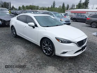 2017 Mazda 6 Grand Touring with VIN JM1GL1X51H1142473, listed as a IAAI auction lot 42234809 with 101,633 mi miles and . Bid and sale history available at DreamBid. Image 1.