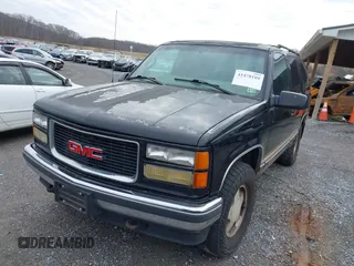 1999 GMC Yukon with VIN 1GKEK13R9XJ807786, listed as a IAAI auction lot 41478109 with 193,748 mi miles. Bid and sale history available at carsss.com. Image 6.
