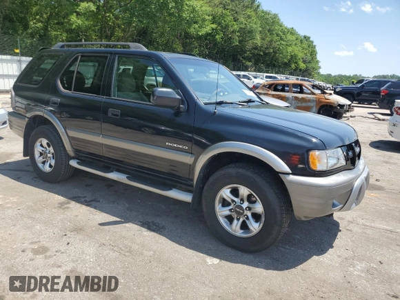 2003 Isuzu Rodeo z VIN 4S2CK58W734311374, wystawiony jako Copart lot #57949325 z przebiegiem 247 580 mil mil oraz Tytuł czysty. Historia ofert i sprzedaży dostępna na DreamBid. Obrazek 4.