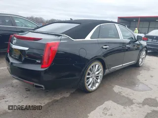 2013 Cadillac XTS Platinum z VIN 2G61V5S37D9194227, wystawiony jako IAAI lot #41510449 z przebiegiem 114 243 mil mil oraz . Historia ofert i sprzedaży dostępna na DreamBid. Obrazek 4.