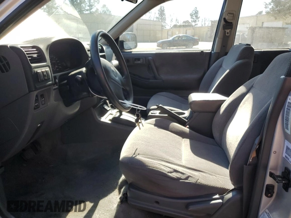 1999 Isuzu Rodeo S with VIN 4S2CK58W7X4357910, listed as a Copart auction lot 86955254 with 105,593 mi miles and Salvage Title. Bid and sale history available at DreamBid. Image 7.