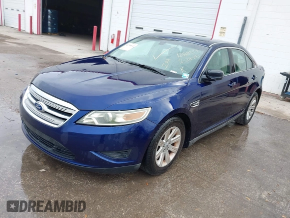 2011 Ford Taurus SE with VIN 1FAHP2DW7BG128857, listed as a IAAI auction lot 41705643 with 163,589 mi miles. Bid and sale history available at carsss.com. Image 2.