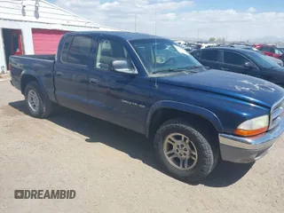 2002 Dodge Dakota SLT with VIN 1B7HL48N32S708719, listed as a IAAI auction lot 42027763 with 217,797 mi miles. Bid and sale history available at carsss.com. Image 1.