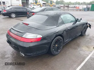 2005 Porsche 911 Carrera z VIN WP0CA299X5S650179, wystawiony jako IAAI lot #42123937 z przebiegiem 52 437 mil mil oraz . Historia ofert i sprzedaży dostępna na DreamBid. Obrazek 4.