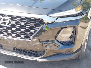 2019 Hyundai Santa Fe SE with VIN 5NMS23AD4KH088902, listed as a IAAI auction lot 42044465 with 34,302 mi miles and . Bid and sale history available at DreamBid. Image 6.