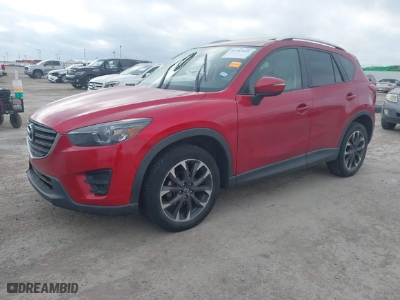 2016 Mazda CX-5 Grand Touring with VIN JM3KE4DYXG0641174, listed as a IAAI auction lot 41182655 with NaN miles. Bid and sale history available at carsss.com. Image 2.