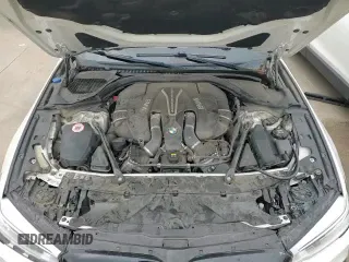 2018 BMW 5 Series M550i xDrive with VIN WBAJB9C54JB034746, listed as a Copart auction lot 71218435 with 128,279 mi miles and Clean title. Bid and sale history available at DreamBid. Image 13.