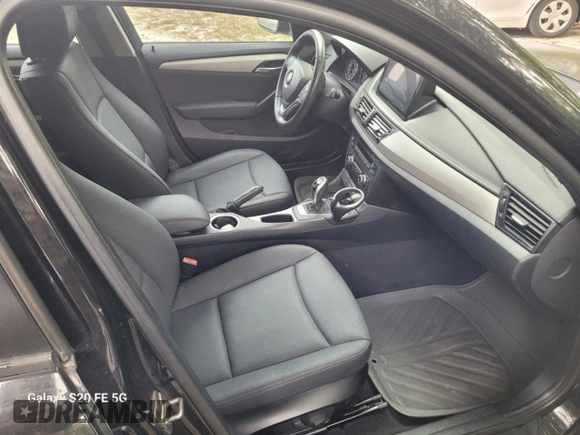 2014 BMW X1 sDrive28i z VIN WBAVM1C58EVW47891, wystawiony jako Copart lot #54916005 z przebiegiem 120 000 mil mil oraz Czysty tytuł • Clean title. Historia ofert i sprzedaży dostępna na DreamBid. Obrazek 5.