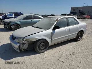 1999 Mazda Protege DX z VIN JM1BJ2227X0161827, wystawiony jako Copart lot #49807925 z przebiegiem 178 415 mil mil oraz Szkoda całkowita • Salvage title. Historia ofert i sprzedaży dostępna na DreamBid. Obrazek 1.