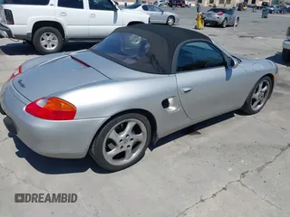 1999 Porsche Boxster with VIN WP0CA2984XU624983, listed as a IAAI auction lot 42722102 with 100,889 mi miles and . Bid and sale history available at DreamBid. Image 4.