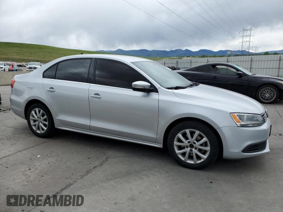 2014 Volkswagen Jetta SE with VIN 3VWD17AJ0EM314456, listed as a Copart auction lot 57380645 with 148,801 mi miles and Salvage title. Bid and sale history available at DreamBid. Image 4.