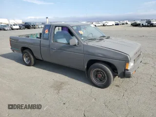 1989 Nissan Hardbody z VIN 1N6ND16S2KC377484, wystawiony jako Copart lot #65412324 z przebiegiem 31 573 mil mil oraz Szkody całkowita. Historia ofert i sprzedaży dostępna na DreamBid. Obrazek 4.