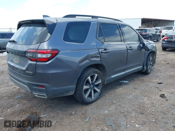 2024 Honda Pilot Touring with VIN 5FNYG2H7XRB014420, listed as a IAAI auction lot 41919635 with Not provided miles and . Bid and sale history available at DreamBid. Image 4.