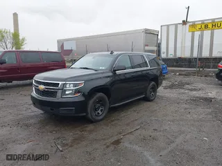 2015 Chevrolet Tahoe Commercial with VIN 1GNSK2EC8FR570602, listed as a IAAI auction lot 41977021 with 115,866 mi miles. Bid and sale history available at carsss.com. Image 6.