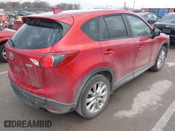 2015 Mazda CX-5 Grand Touring with VIN JM3KE4DY1F0540586, listed as a IAAI auction lot 41710216 with 148,800 mi miles. Bid and sale history available at carsss.com. Image 4.