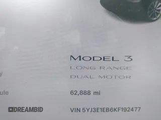 2019 Tesla Model 3 Long Range with VIN 5YJ3E1EB6KF192477, listed as a IAAI auction lot 41981600 with 62,888 mi miles. Bid and sale history available at carsss.com. Image 7.