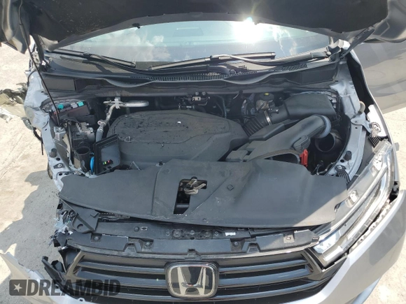 2023 Honda Odyssey Touring z VIN 5FNRL6H8XPB037385, wystawiony jako Copart lot #59461215 z przebiegiem 32 150 mil mil oraz Szkoda całkowita • Salvage title. Historia ofert i sprzedaży dostępna na DreamBid. Obrazek 12.