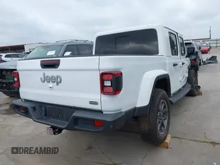 2021 Jeep Gladiator High Altitude with VIN 1C6HJTFG8ML551570, listed as a IAAI auction lot 42229235 with 56,959 mi miles and . Bid and sale history available at DreamBid. Image 4.