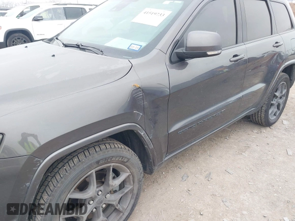 2021 Jeep Grand Cherokee 80th Anniversary z VIN 1C4RJFBGXMC621817, wystawiony jako IAAI lot #41519733 z przebiegiem 60 552 mil mil oraz . Historia ofert i sprzedaży dostępna na DreamBid. Obrazek 17.
