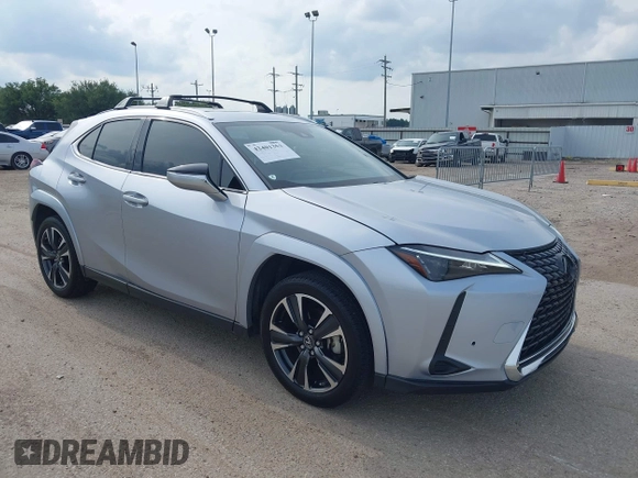 2023 Lexus UX 250h Premium z VIN JTHP6JBH5P2145912, wystawiony jako IAAI lot #42401353 z przebiegiem 14 252 mil mil oraz . Historia ofert i sprzedaży dostępna na DreamBid. Obrazek 1.