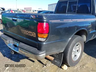1998 Mazda B-Series 2WD Truck SX with VIN 4F4YR12C4WTM47743, listed as a IAAI auction lot 41430832 with 318,909 mi miles. Bid and sale history available at carsss.com. Image 18.