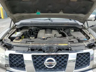 2006 Nissan Armada LE z VIN 5N1AA08B76N710950, wystawiony jako Copart lot #55981715 z przebiegiem 242 233 mil mil oraz Szkoda całkowita • Salvage title. Historia ofert i sprzedaży dostępna na DreamBid. Obrazek 12.