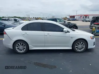 2016 Mitsubishi Lancer ES z VIN JA32U2FU7GU000923, wystawiony jako IAAI lot #42238951 z przebiegiem 134 955 mil mil oraz . Historia ofert i sprzedaży dostępna na DreamBid. Obrazek 13.
