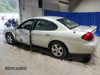 2003 Ford Taurus SE Standard z VIN 1FAFP532X3A195612, wystawiony jako Copart lot #54016645 z przebiegiem 143 168 mil mil oraz Szkoda całkowita • Salvage title. Historia ofert i sprzedaży dostępna na DreamBid. Obrazek 2.