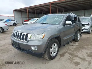 2013 Jeep Grand Cherokee Laredo with VIN 1C4RJEAG2DC571569, listed as a IAAI auction lot 41100518 with 98,265 mi miles. Bid and sale history available at carsss.com. Image 17.