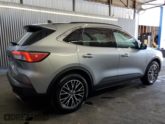 2021 Ford Escape Titanium Plug-In Hybrid z VIN 1FMCU0LZ8MUA66995, wystawiony jako Copart lot #60986765 z przebiegiem 69 609 mil mil oraz Czysty tytuł • Clean title. Historia ofert i sprzedaży dostępna na DreamBid. Obrazek 3.