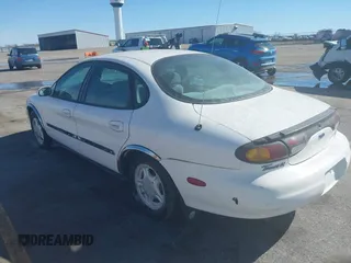 1996 Ford Taurus GL z VIN 1FALP52U0TG128147, wystawiony jako IAAI lot #41604450 z przebiegiem 152 949 mil mil oraz . Historia ofert i sprzedaży dostępna na DreamBid. Obrazek 3.