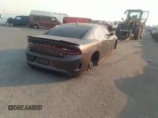 2019 Dodge Charger Scat Pack with VIN 2C3CDXGJ2KH564051, listed as a IAAI auction lot 41255283 with 64,687 mi miles and . Bid and sale history available at DreamBid. Image 4.