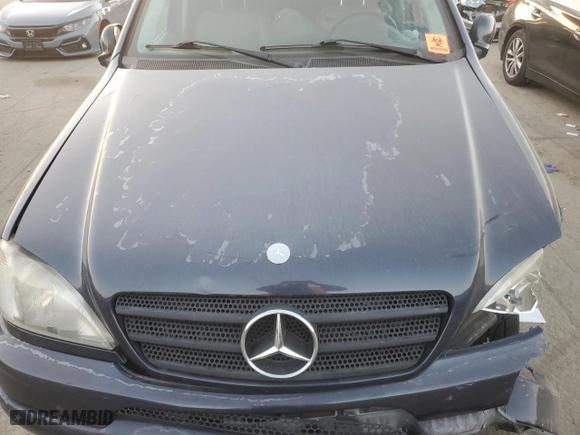 2001 Mercedes-Benz M-Class with VIN 4JGAB72E91A260677, listed as a Copart auction lot 89200235 with 180,414 mi miles and Salvage Title. Bid and sale history available at carsss.com. Image 11.