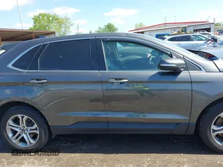 2015 Ford Edge Titanium z VIN 2FMPK4K83FBB30411, wystawiony jako IAAI lot #42230235 z przebiegiem 69 094 mil mil oraz . Historia ofert i sprzedaży dostępna na DreamBid. Obrazek 14.