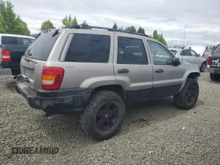 2000 Jeep Grand Cherokee Laredo with VIN 1J4GW48S9YC390448, listed as a Copart auction lot 56985265 with Not provided miles and Salvage title. Bid and sale history available at DreamBid. Image 3.